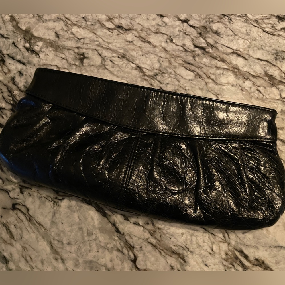 Black leather Aldo clutch purse (with inside pocket).